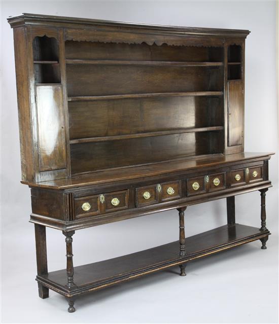 An 18th century oak dresser, W.7ft 9in. D.1ft 7in. H.6ft 6in.